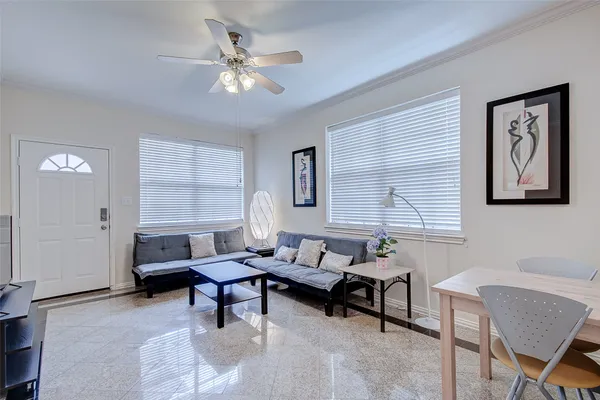 a living room with furniture and a window