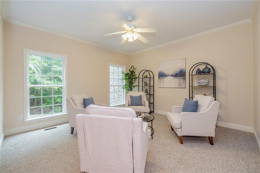 394 South Alexander Creek Road Newnan, GA 30263 - Photo 14 of 76 a living room with furniture and a large window