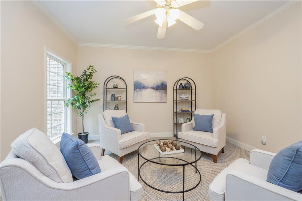 394 South Alexander Creek Road Newnan, GA 30263 - Photo 15 of 76 a living room with furniture a couch and a chandelier
