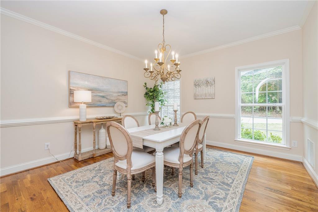 394 South Alexander Creek Road Newnan, GA 30263 - Photo 16 of 76 a dining room with furniture and window