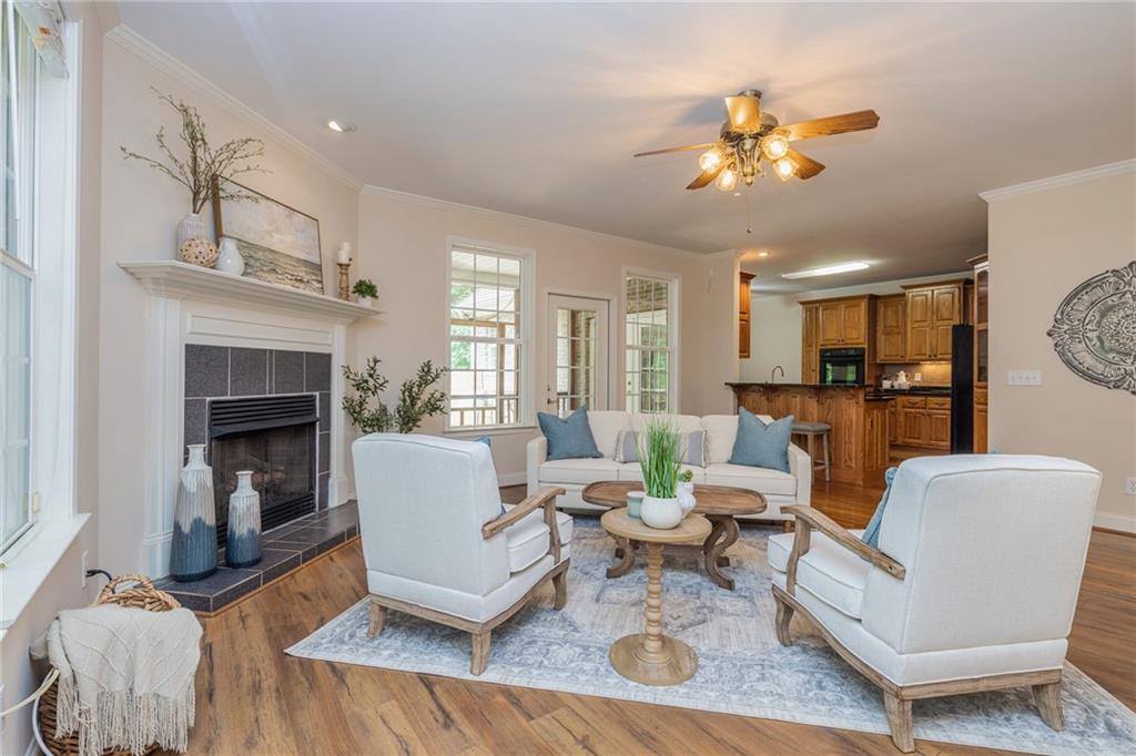 394 South Alexander Creek Road Newnan, GA 30263 - Photo 20 of 76 a living room with furniture and a fireplace