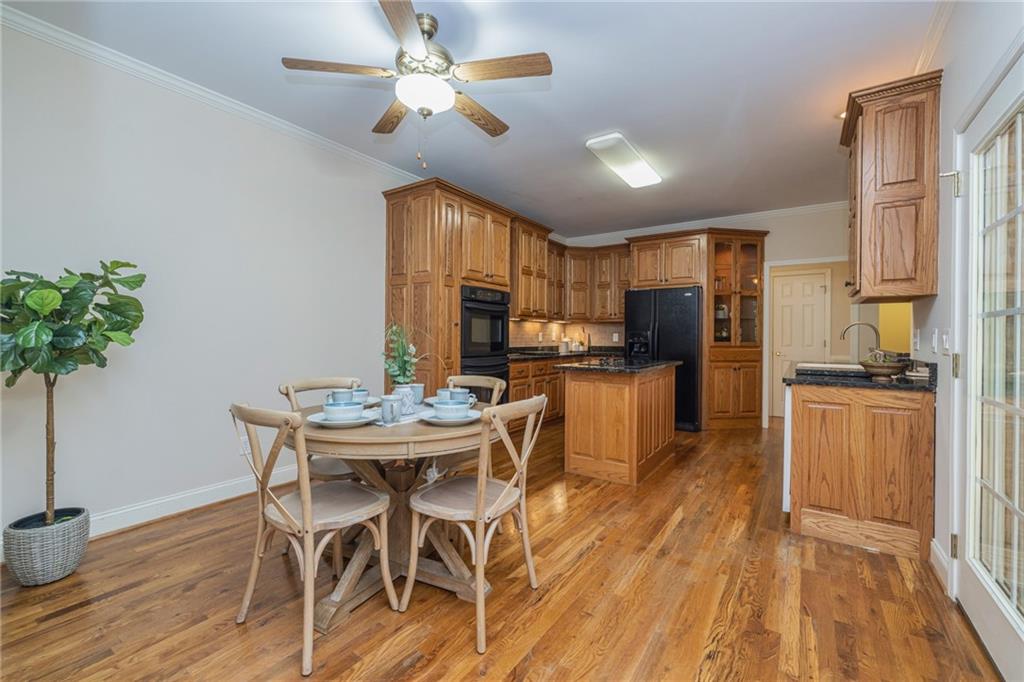 394 South Alexander Creek Road Newnan, GA 30263 - Photo 23 of 76 a view of a dining room with furniture window and wooden floor