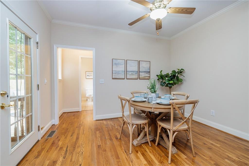 394 South Alexander Creek Road Newnan, GA 30263 - Photo 24 of 76 a view of a dining room with furniture and wooden floor