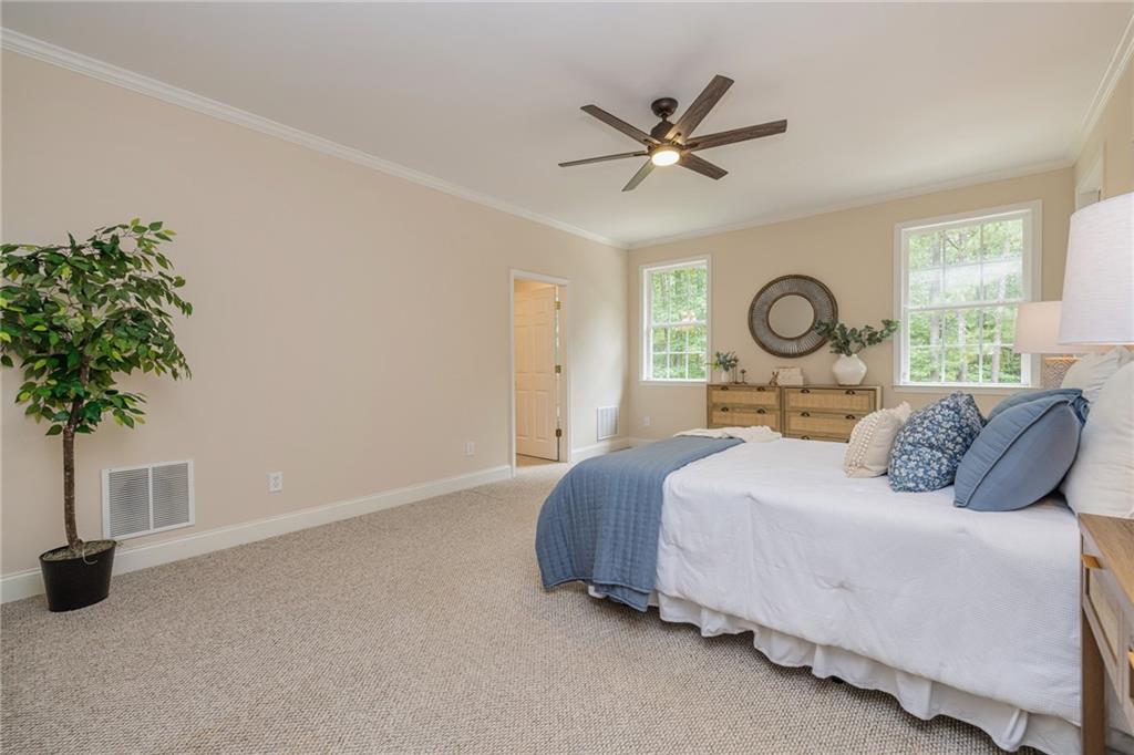 394 South Alexander Creek Road Newnan, GA 30263 - Photo 27 of 76 a bedroom with a bed and window