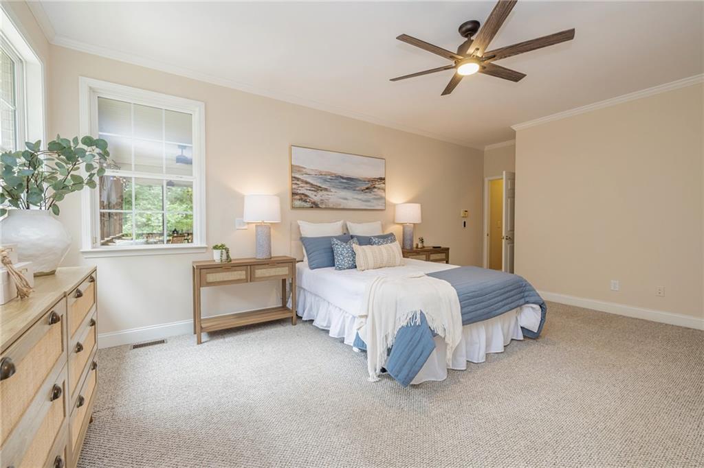 394 South Alexander Creek Road Newnan, GA 30263 - Photo 29 of 76 a spacious bedroom with a bed and a window
