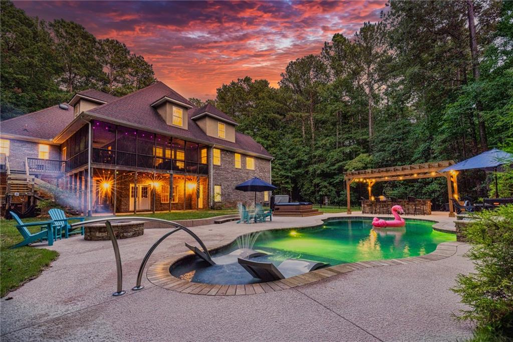 394 South Alexander Creek Road Newnan, GA 30263 - Photo 3 of 76 front view of a house with a yard table and chairs