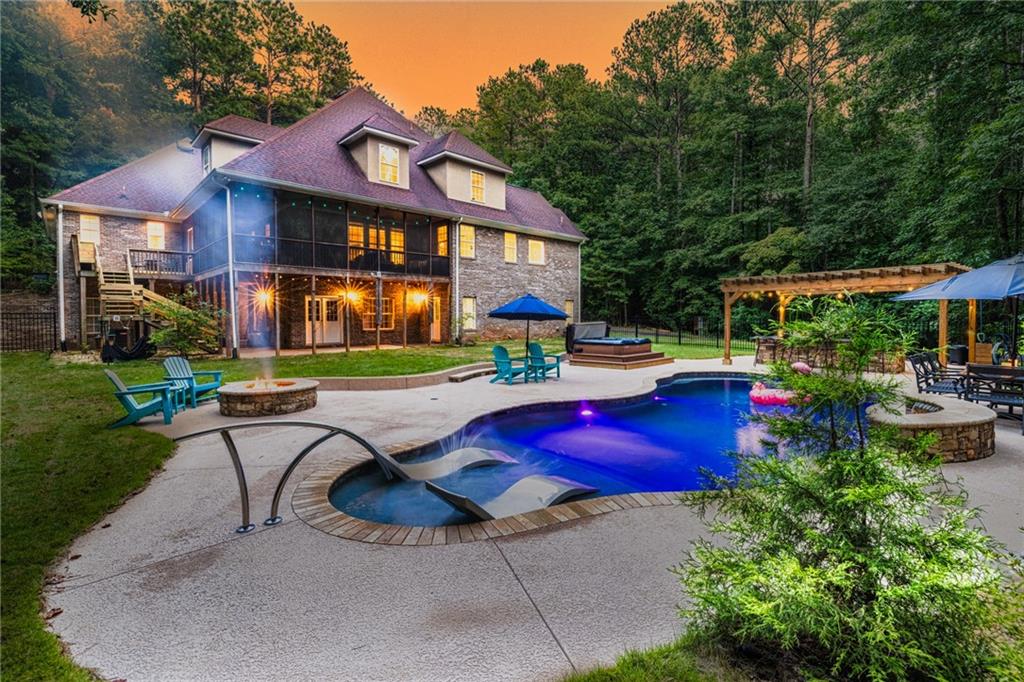 394 South Alexander Creek Road Newnan, GA 30263 - Photo 4 of 76 a view of a swimming pool with sitting area and furniture