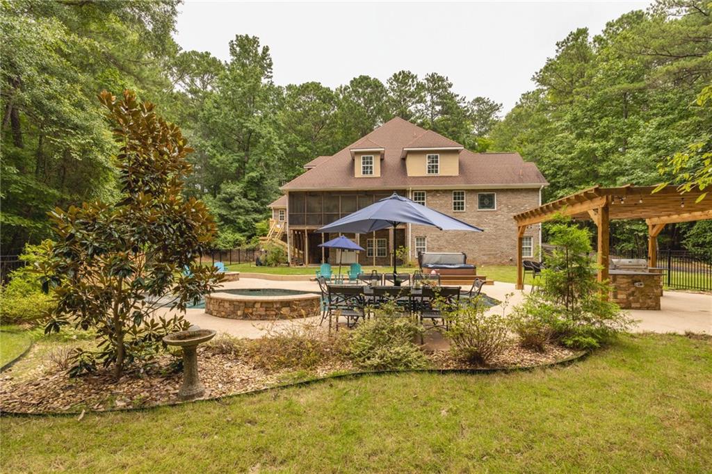 394 South Alexander Creek Road Newnan, GA 30263 - Photo 50 of 76 a front view of a house with a yard