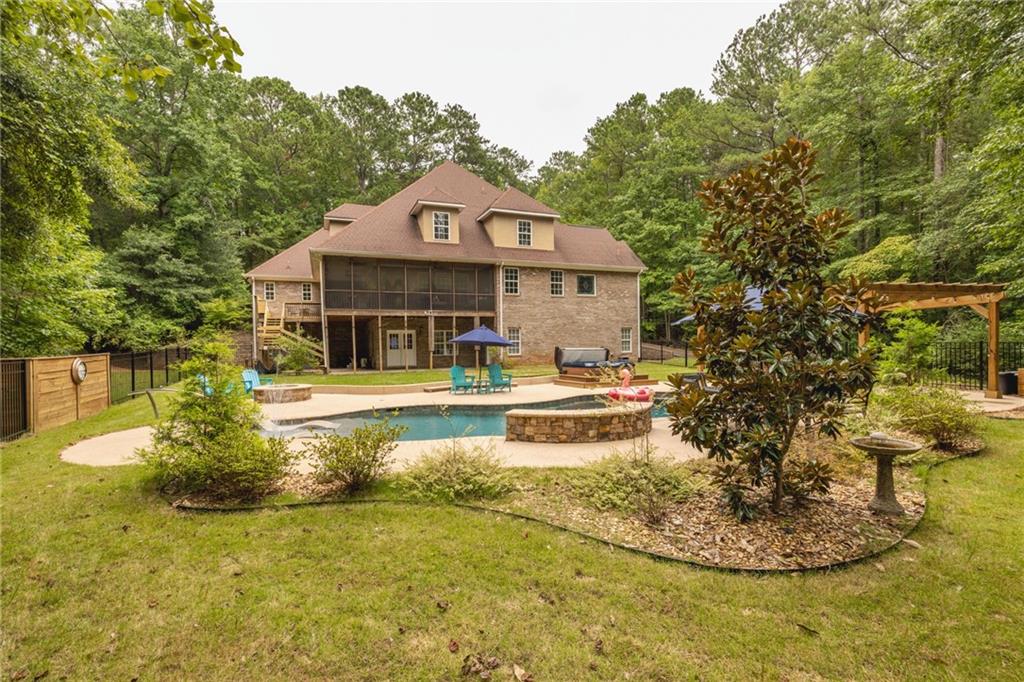394 South Alexander Creek Road Newnan, GA 30263 - Photo 51 of 76 a view of a house with a swimming pool
