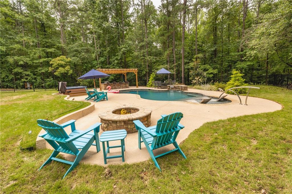 394 South Alexander Creek Road Newnan, GA 30263 - Photo 55 of 76 a view of a swimming pool with lounge chairs