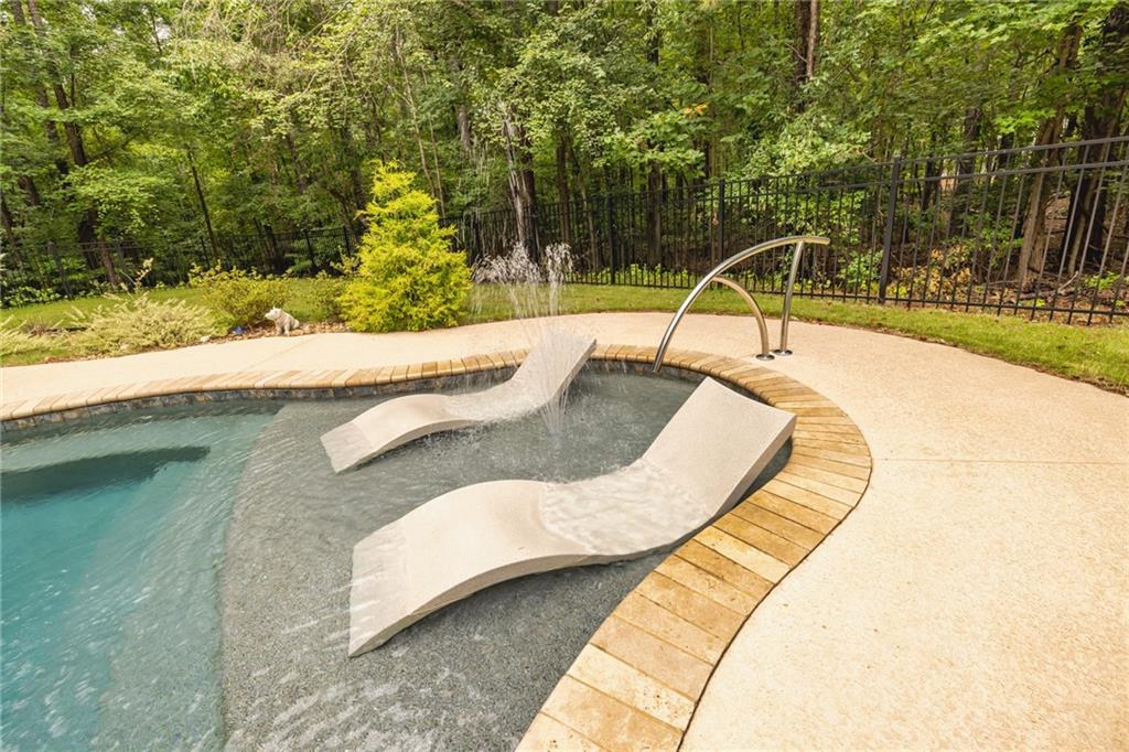394 South Alexander Creek Road Newnan, GA 30263 - Photo 56 of 76 a view of a swimming pool with a patio