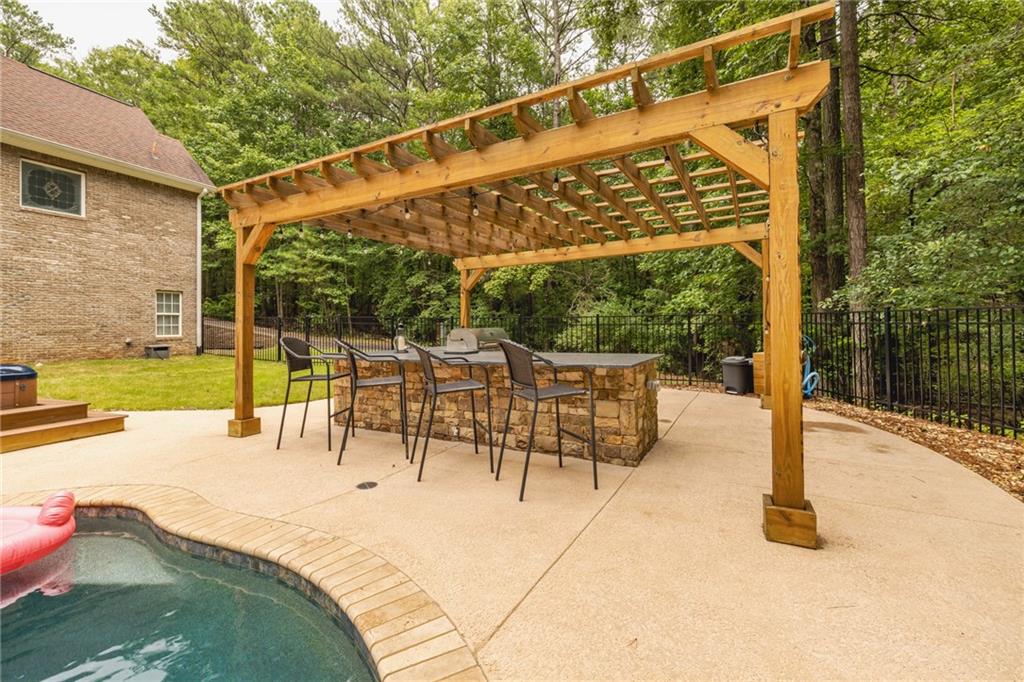 394 South Alexander Creek Road Newnan, GA 30263 - Photo 58 of 76 a view of back yard with patio