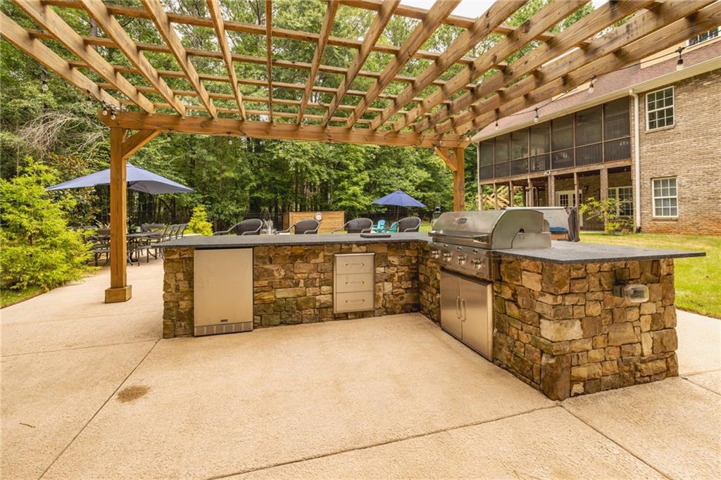 394 South Alexander Creek Road Newnan, GA 30263 - Photo 6 of 76 a view of a chairs and table in the patio
