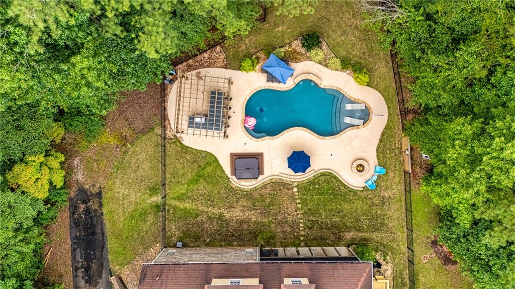 394 South Alexander Creek Road Newnan, GA 30263 - Photo 65 of 76 an aerial view of a house with a yard and trees