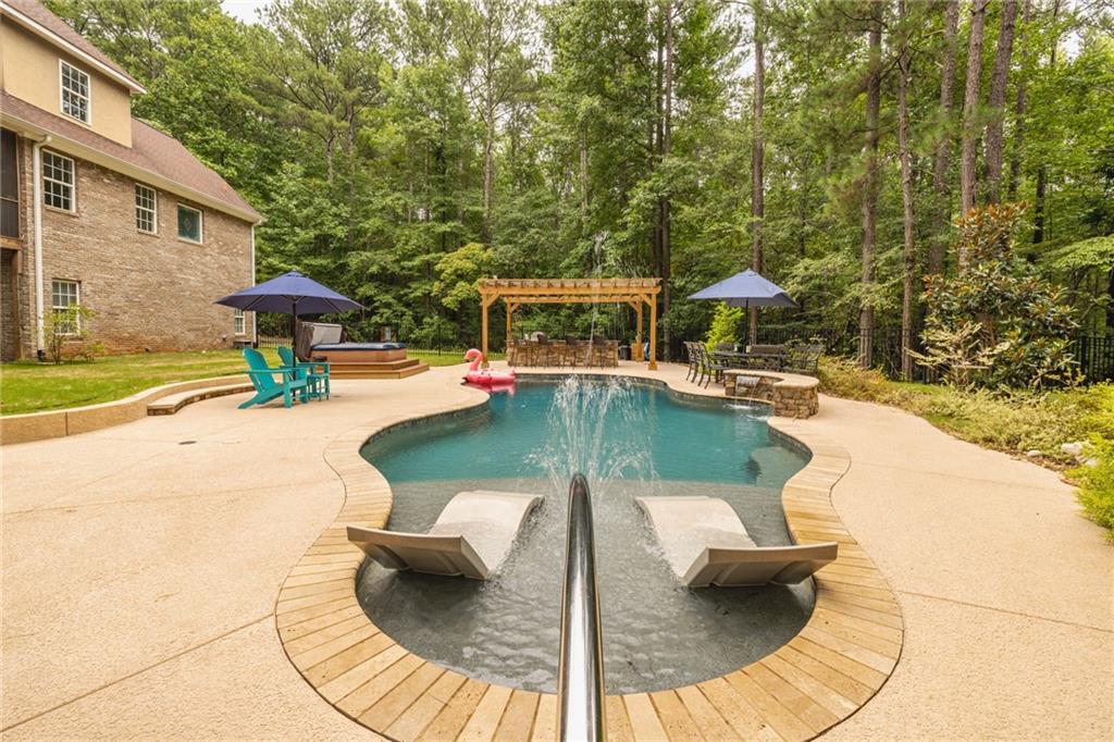 394 South Alexander Creek Road Newnan, GA 30263 - Photo 8 of 76 swimming pool view with a seating space