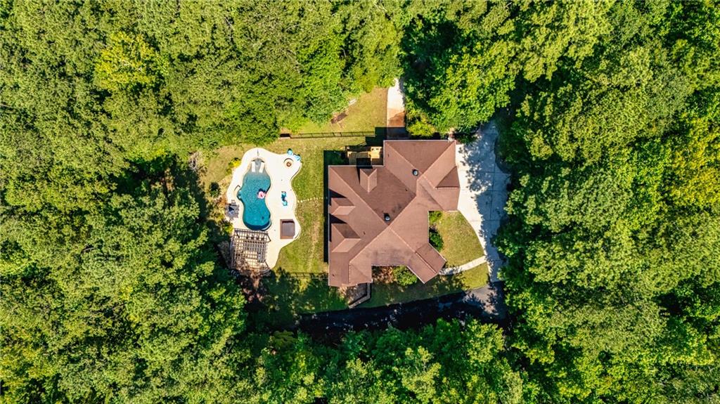 394 South Alexander Creek Road Newnan, GA 30263 - Photo 9 of 76 an aerial view of residential house with outdoor space and trees all around