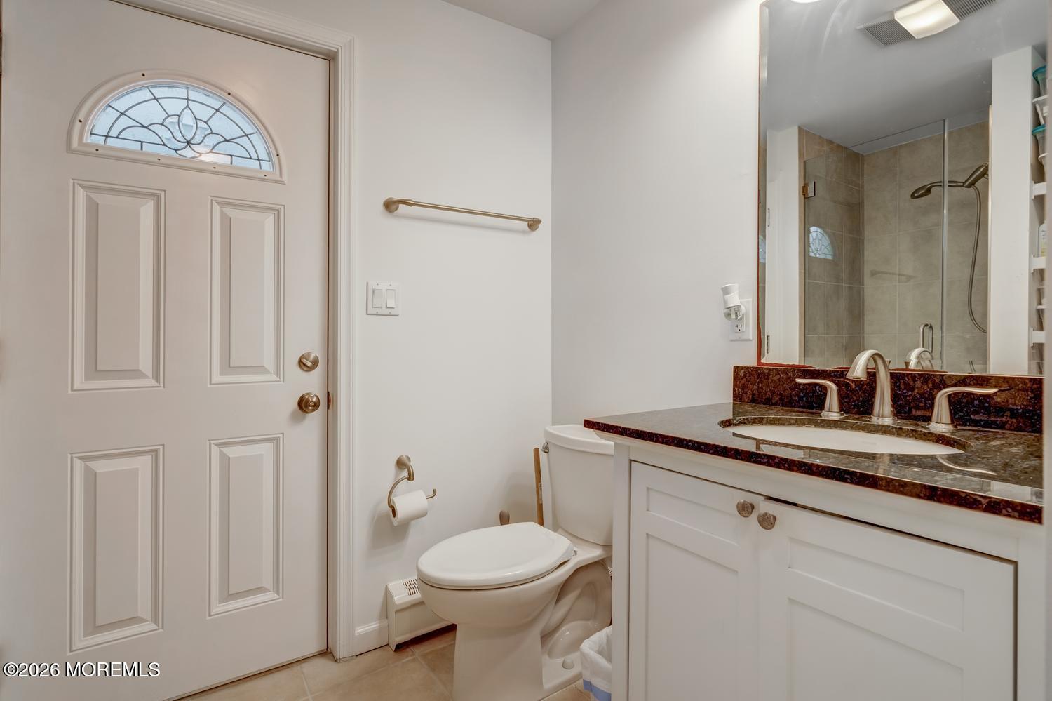 19 Shore Way Lavallette, NJ 08735 - Photo 10 of 38 a bathroom with a granite countertop toilet sink and mirror