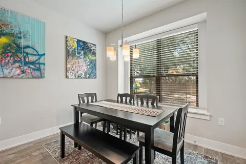 a view of a dining room with furniture and window