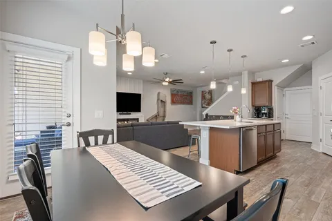 a kitchen with kitchen island a large island in it