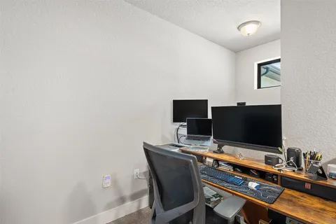 a view of a workspace with furniture