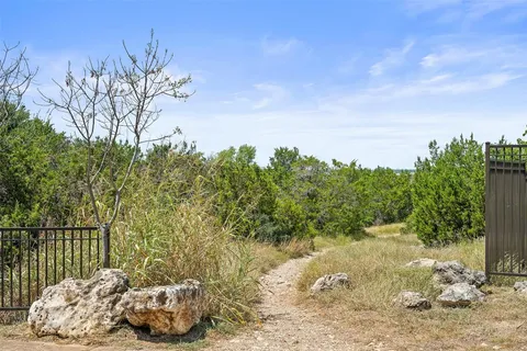 a view of a backyard of the house