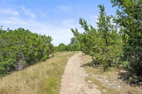 a view of a lake with houses in the background