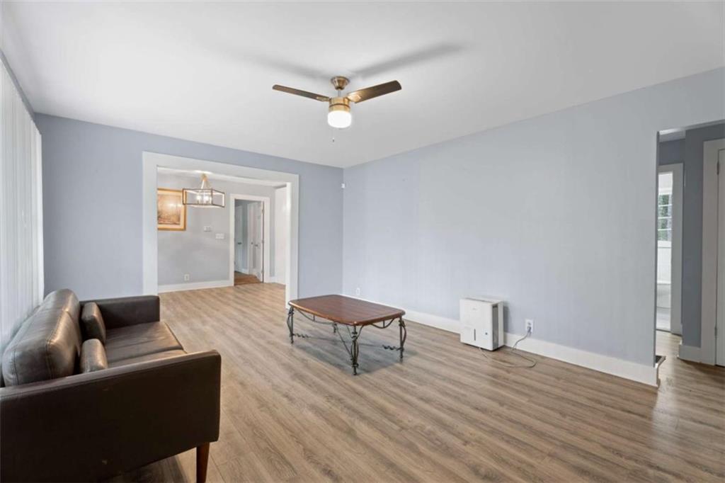 1621 North Columbia Place Decatur, GA 30032 - Photo 11 of 38 a living room with furniture and a ceiling fan