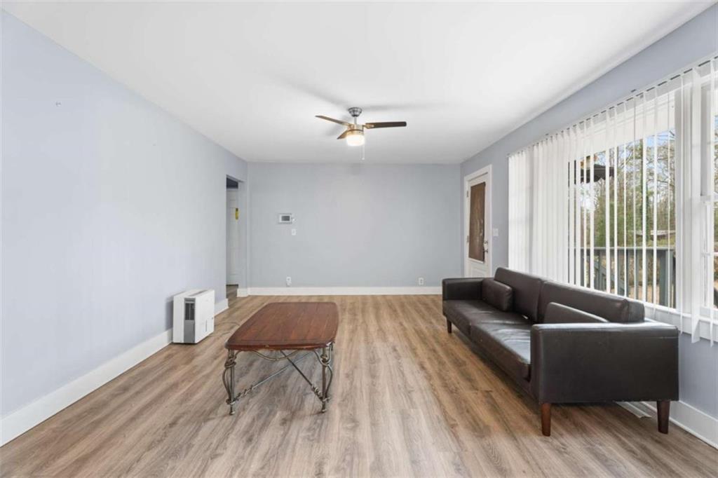 1621 North Columbia Place Decatur, GA 30032 - Photo 13 of 38 a living room with furniture and wooden floor