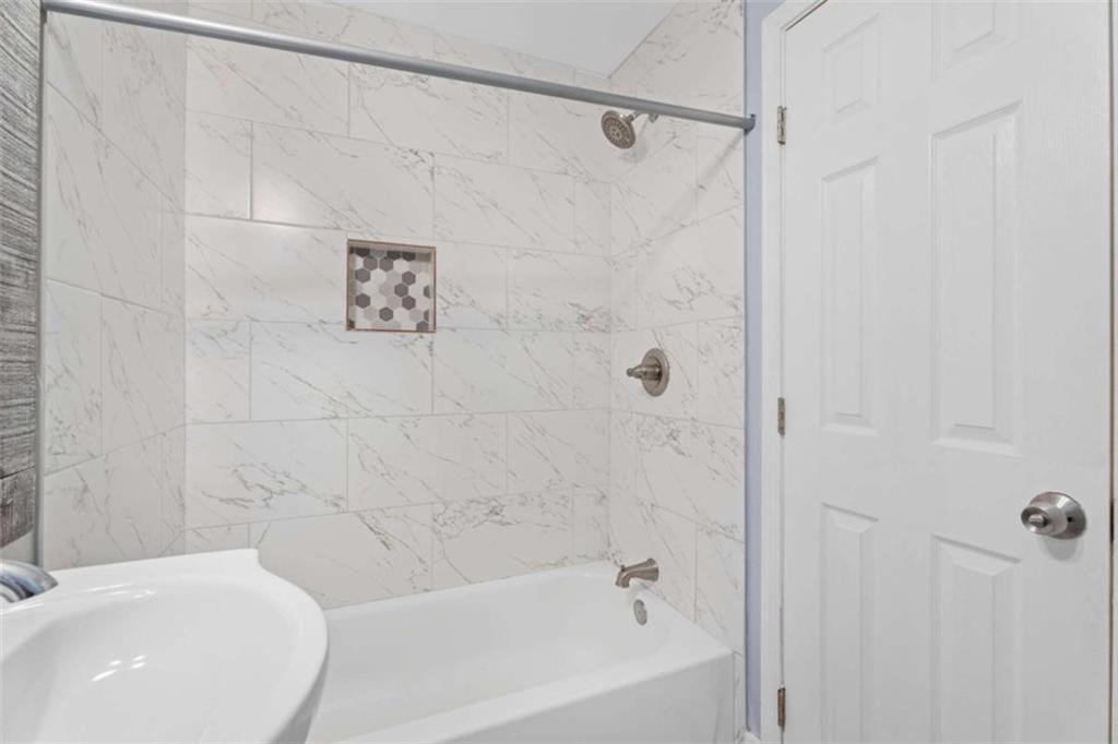 1621 North Columbia Place Decatur, GA 30032 - Photo 18 of 38 a bathroom with a white bath tub