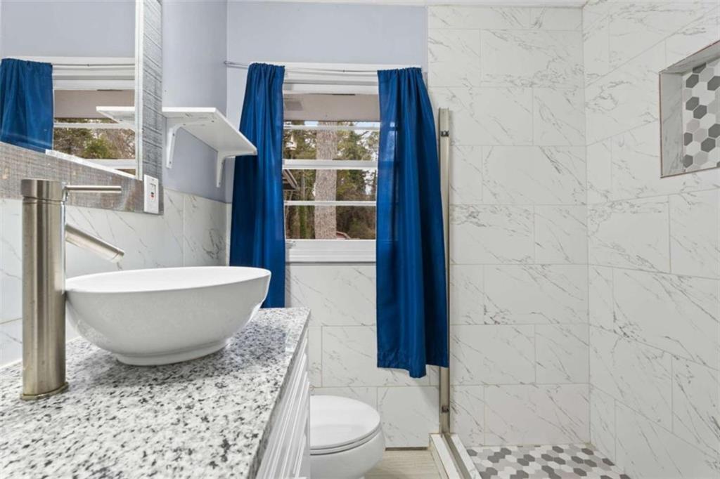 1621 North Columbia Place Decatur, GA 30032 - Photo 25 of 38 a living room with a couch and a table