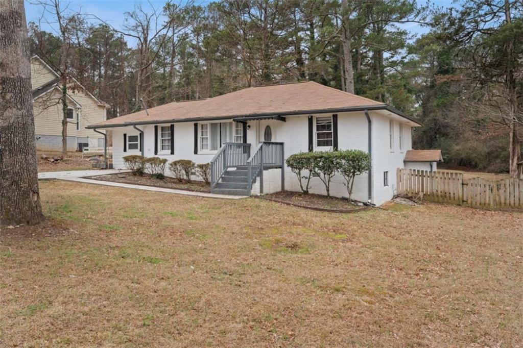 1621 North Columbia Place Decatur, GA 30032 - Photo 3 of 38 a front view of a house with yard and sitting area