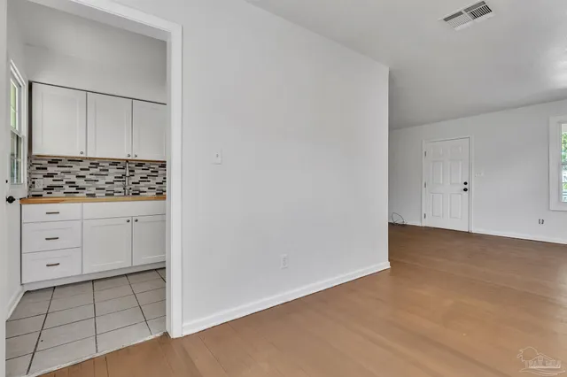a view of cabinets and utility room