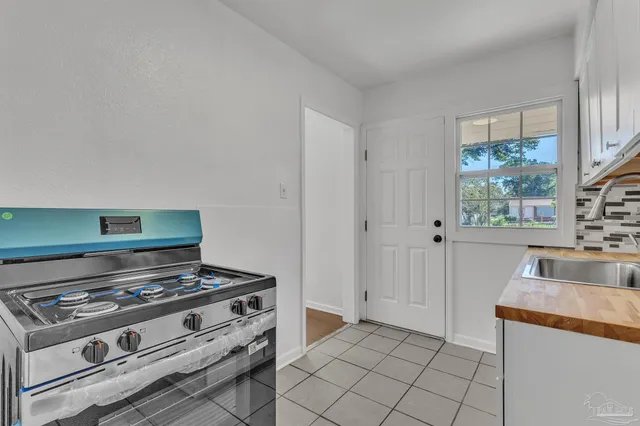 a kitchen with a stove and a sink