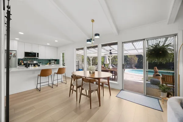 a view of a dining room with furniture window and outside view