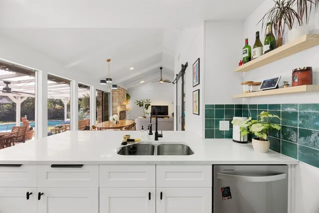 a kitchen with a sink and cabinets