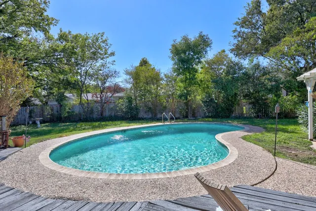 a view of a swimming pool with a patio