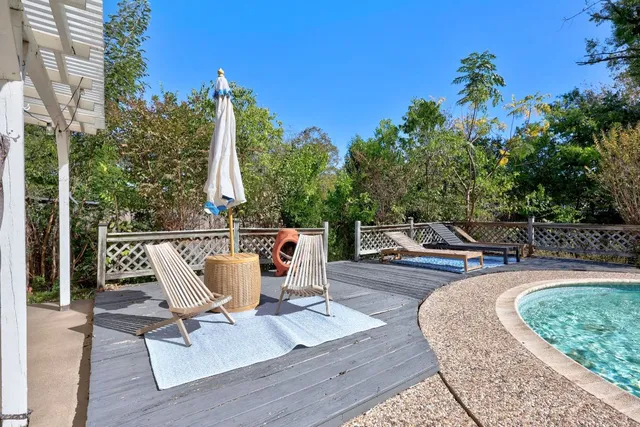 a view of a chairs and table in the patio