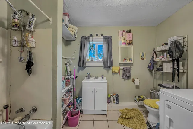 a bathroom with a sink mirror and vanity