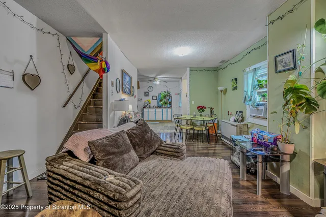 a living room with furniture and flowers