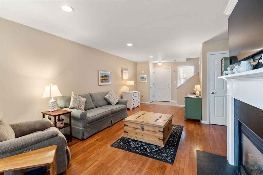7 Bisbee Drive, Unit 7 Rochester, MA 02770 - Photo 15 of 39 a living room with furniture and a fireplace