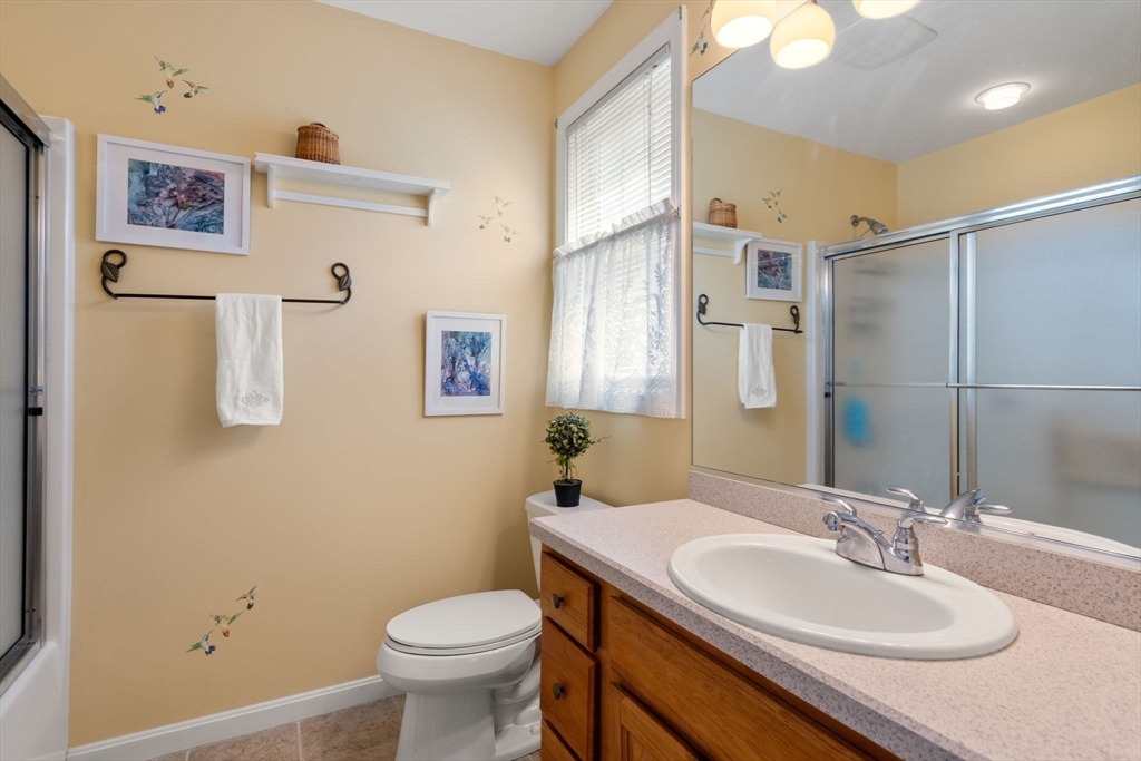 7 Bisbee Drive, Unit 7 Rochester, MA 02770 - Photo 24 of 39 a bathroom with a sink toilet and a mirror