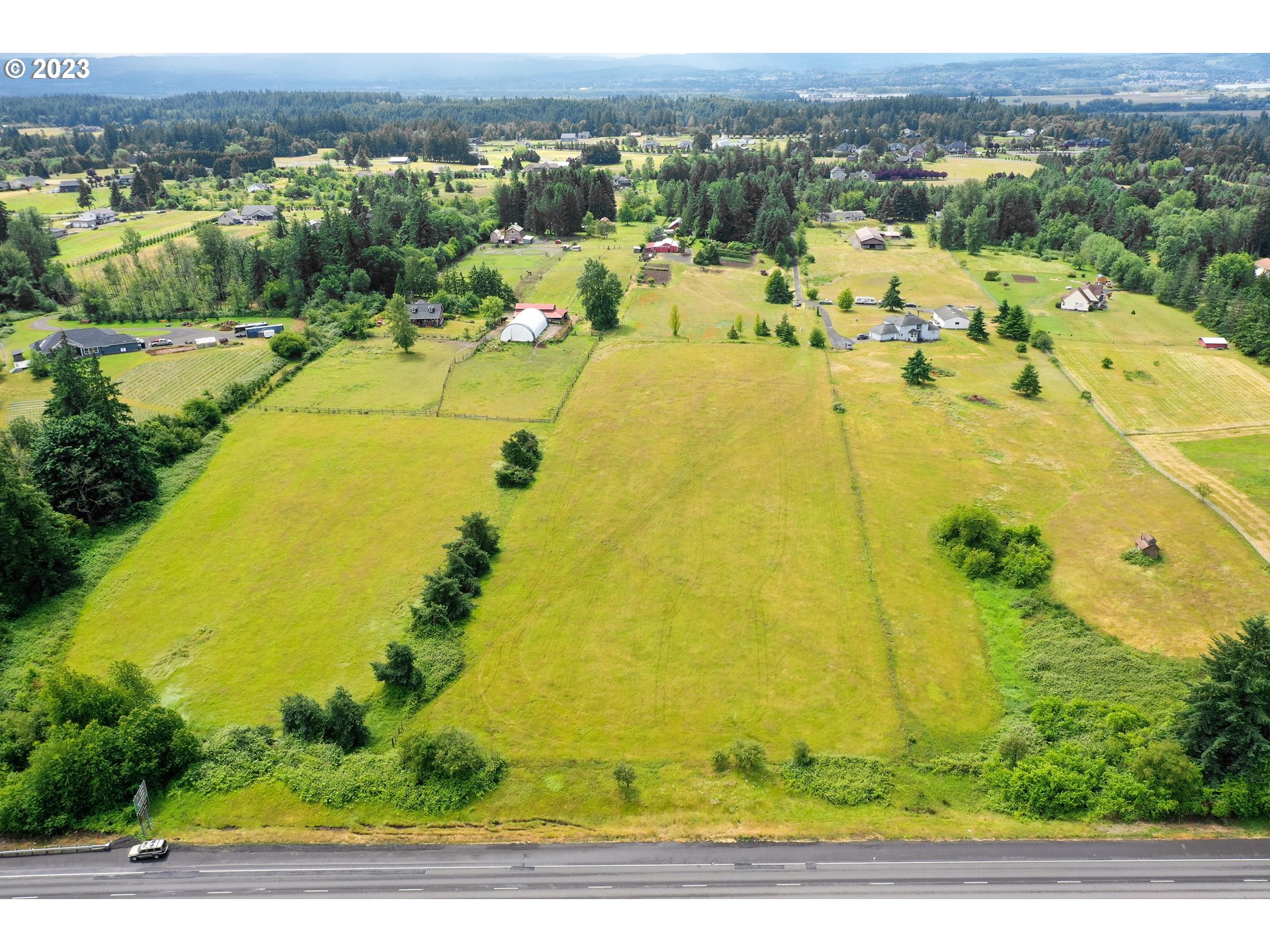 a view of a swimming pool with a yard