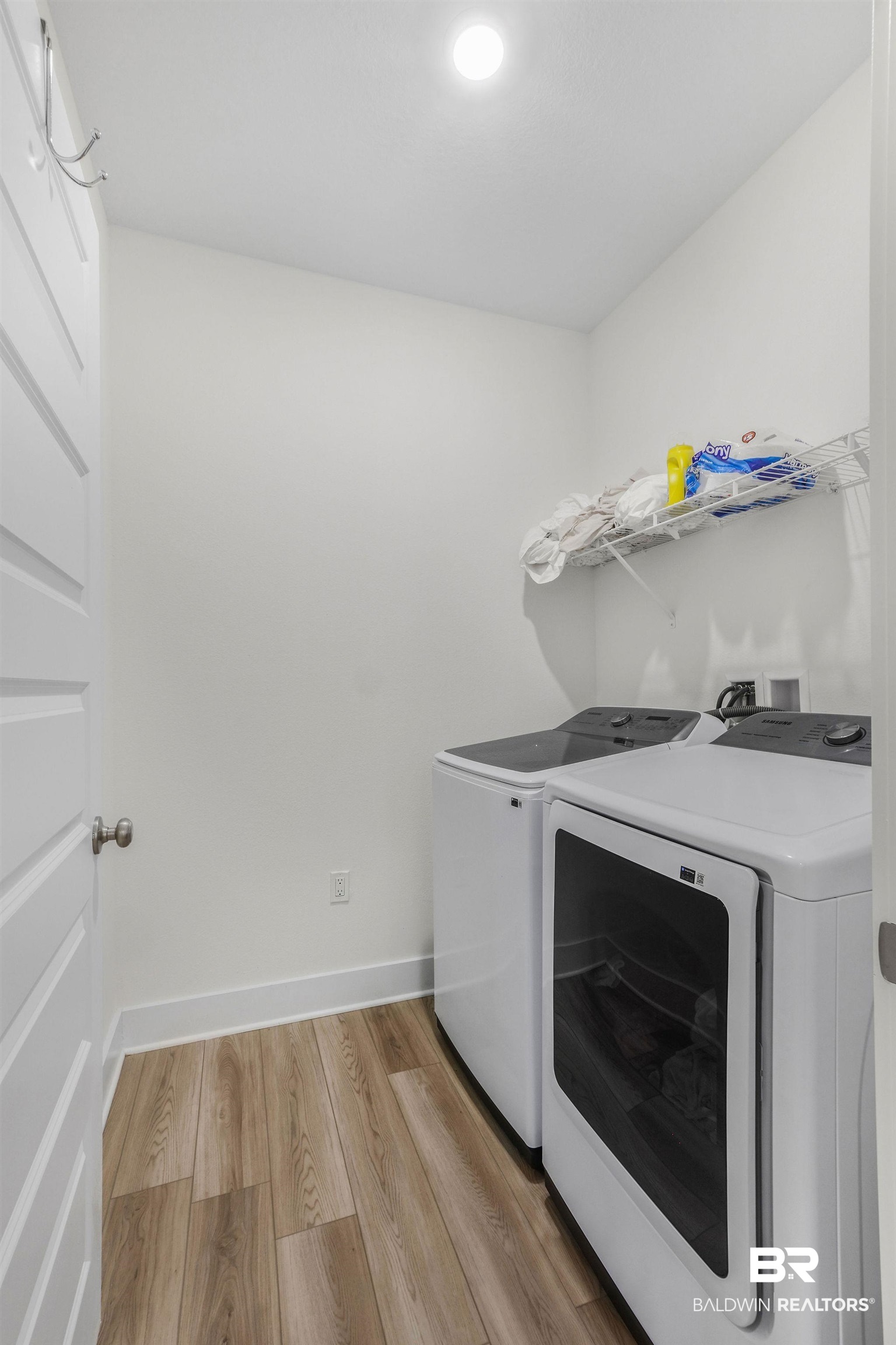 9859 Willet Way Foley, AL 36535 - Photo 22 of 23 Laundry room with light wood-style flooring and independent washer and dryer