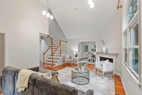 a living room with furniture and a table