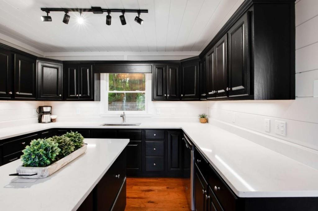 231 Sunrock Mountain Trail Blue Ridge, GA 30513 - Photo 16 of 61 a kitchen with a sink window and cabinets