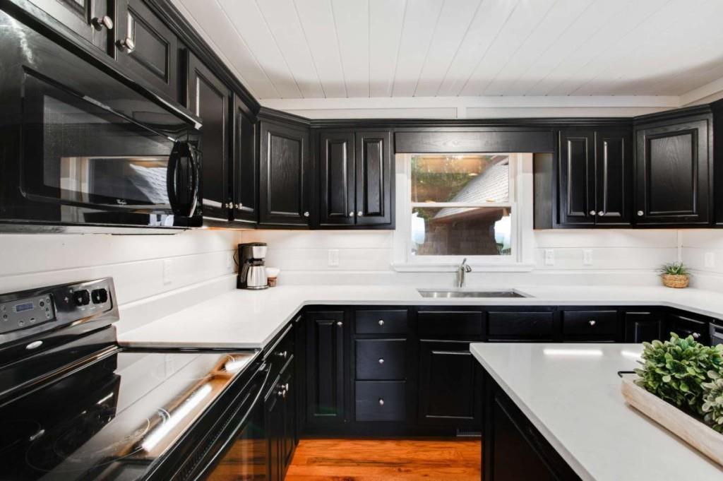 231 Sunrock Mountain Trail Blue Ridge, GA 30513 - Photo 19 of 61 a kitchen with a sink and a stove top oven
