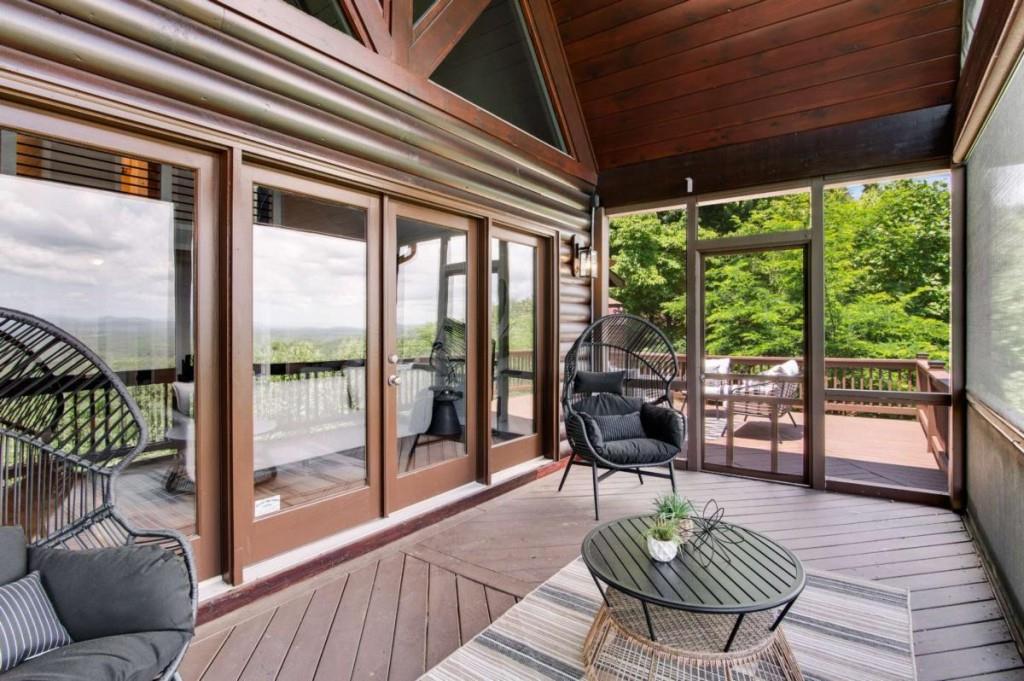 231 Sunrock Mountain Trail Blue Ridge, GA 30513 - Photo 22 of 61 a living room with furniture and a large window