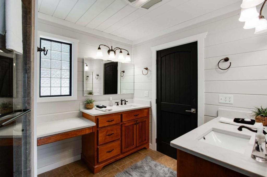 231 Sunrock Mountain Trail Blue Ridge, GA 30513 - Photo 33 of 61 a bathroom with a sink vanity and mirror