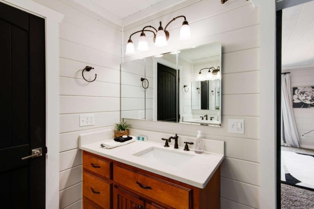 231 Sunrock Mountain Trail Blue Ridge, GA 30513 - Photo 34 of 61 a bathroom with a sink and a mirror