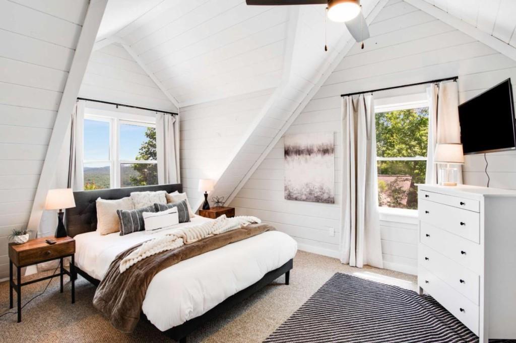 231 Sunrock Mountain Trail Blue Ridge, GA 30513 - Photo 37 of 61 a bedroom with a bed and a flat screen tv